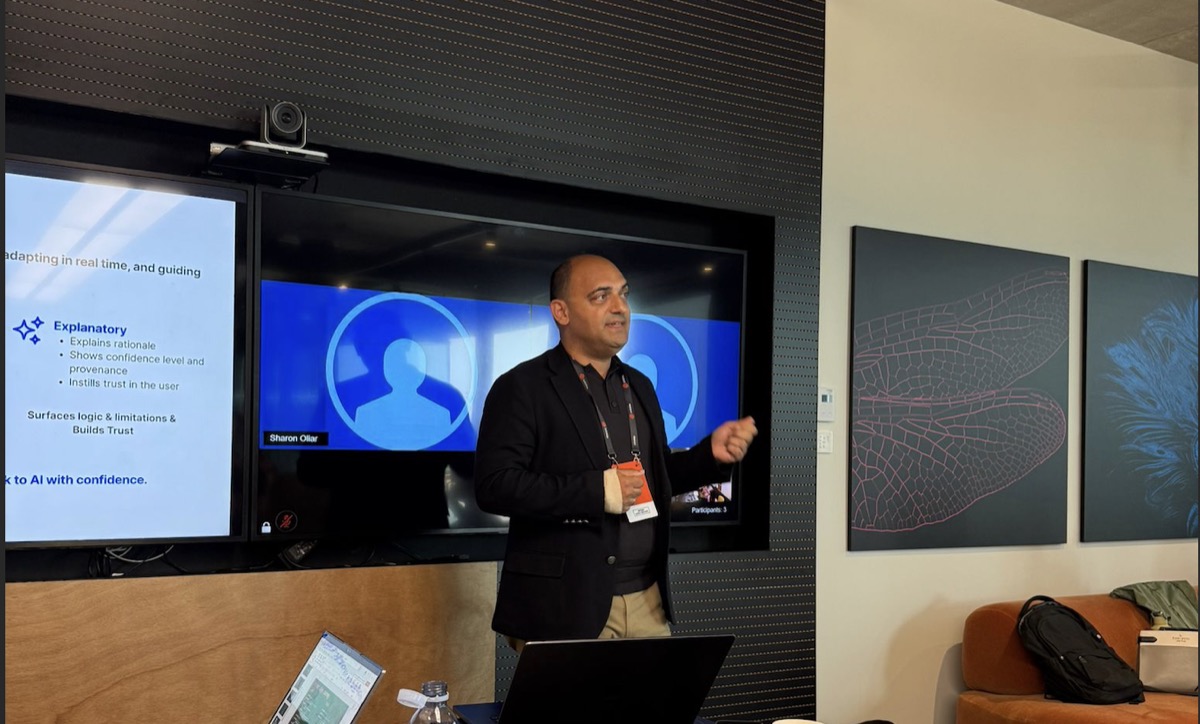 Özgür Güler speaking during an AI workshop.
